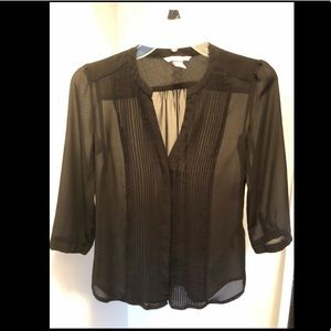 Semi-sheer black blouse with invisible buttons